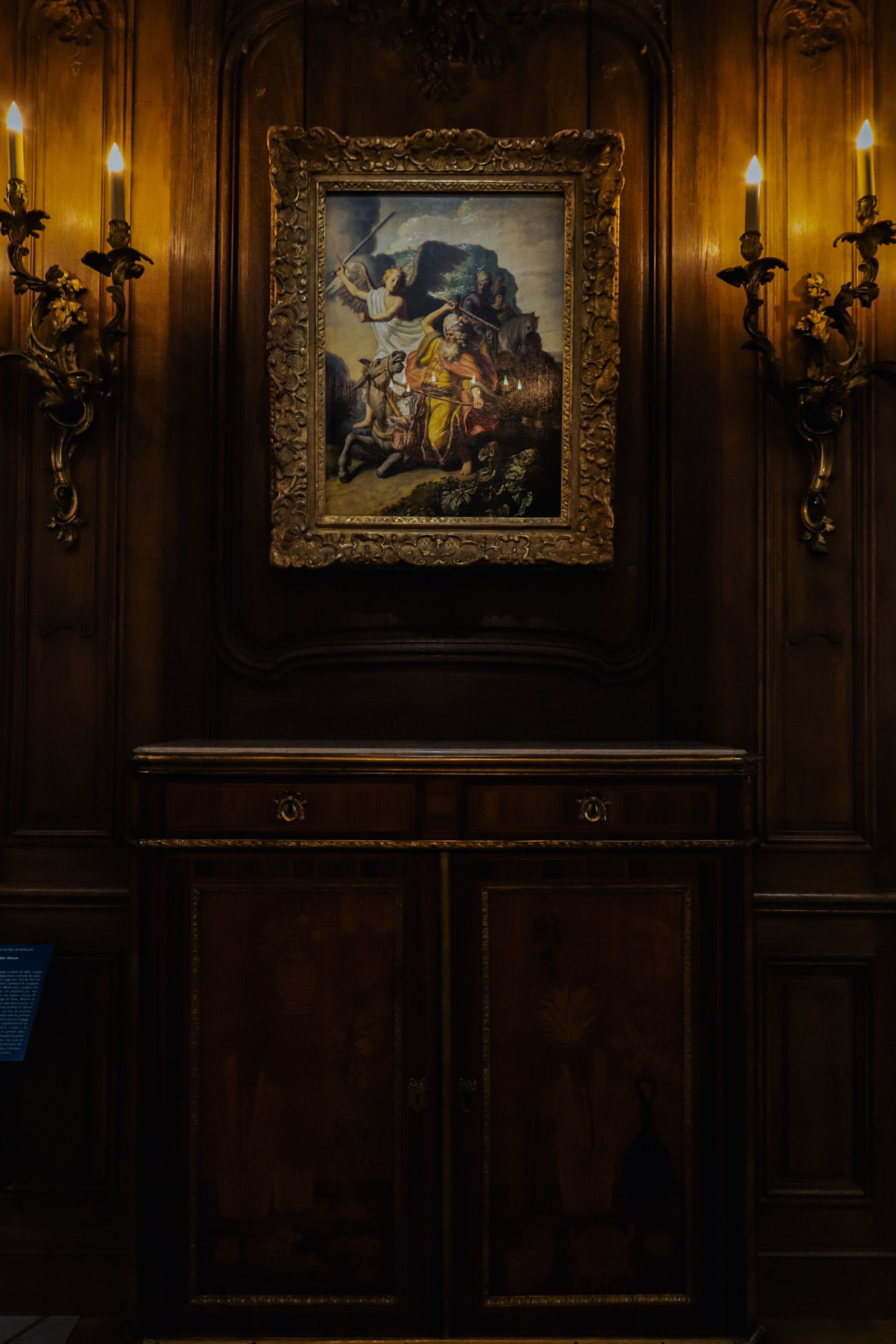 A classical portrait in a candlelit dark-academia interior